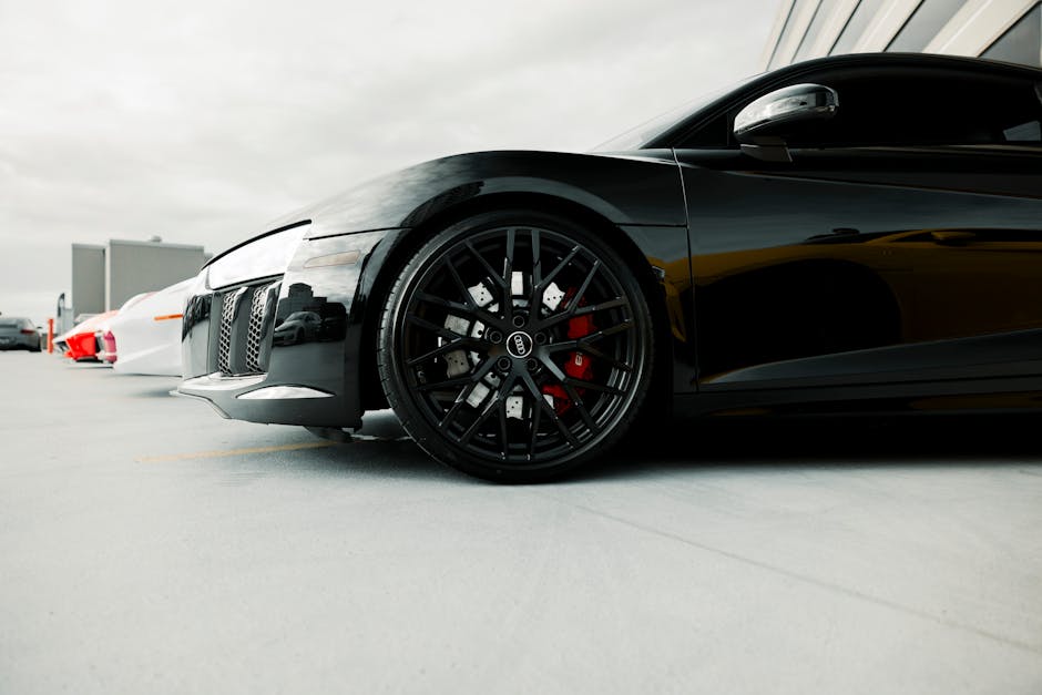Shiny black sports car showcasing premium ceramic coating